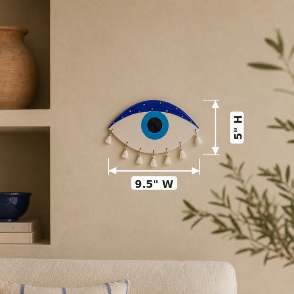 Ceramic Evil Eye with Gold Touches Wall Decor — dimensions: 9.5" W × 5" H