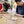 Two people working on pottery in a classroom setting